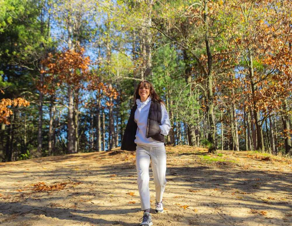 Person walking outdoors as part of a healthier lifestyle