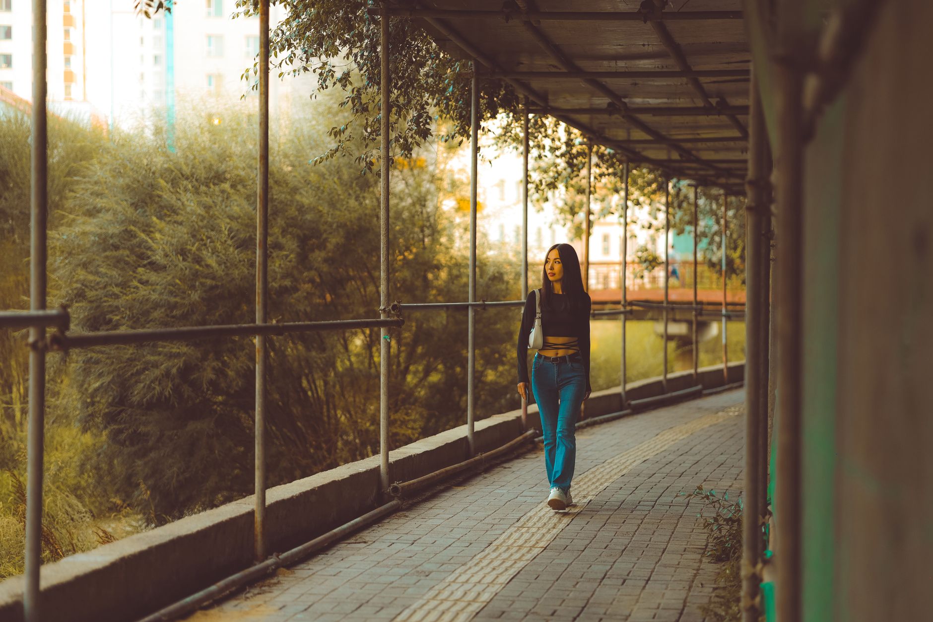 A young woman walking outdoors